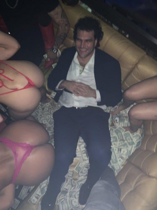 A man in a suit is seated surrounded by money and several women, likely referencing a decadent lifestyle associated with the "RH bullposting from Size Chad" which the post compares to "Arbitrum TGE flashbacks."