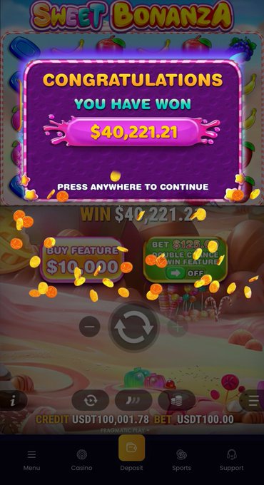 The image shows a phone screen displaying a casino game called "Sweet Bonanza" with colorful candies, fruit, and other decorations as its main elements. The text below the screen reads "Congratulations you have won $40,200,201". In addition to the text, there is a small photo of an item that looks like candy or some sort of decoration related to the game. The background color of the image appears to be purple with a yellow element in the middle, and the bottom portion of the screen has more information about this game on its right side.