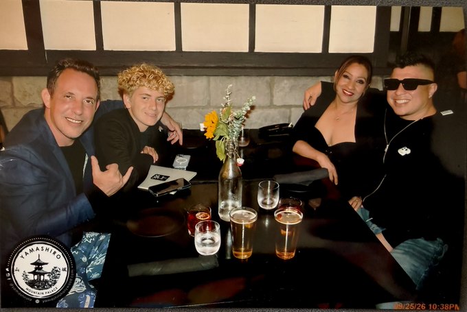 Four people pose together at a table with drinks and flowers; a stamp in the corner reads "YAMASHIRO Established 1947 Honolulu," and a timestamp shows "09/25/26 10:38PM".