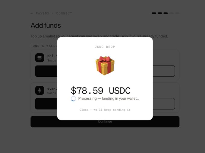 The image shows a popup on Paybox confirming a USDC airdrop of $78.59, with a "Processing — landing in your wallet..." message beneath a gift box icon, illustrating the free USDC reward users can earn by interacting with MoonPay's AI agent as described in the post.