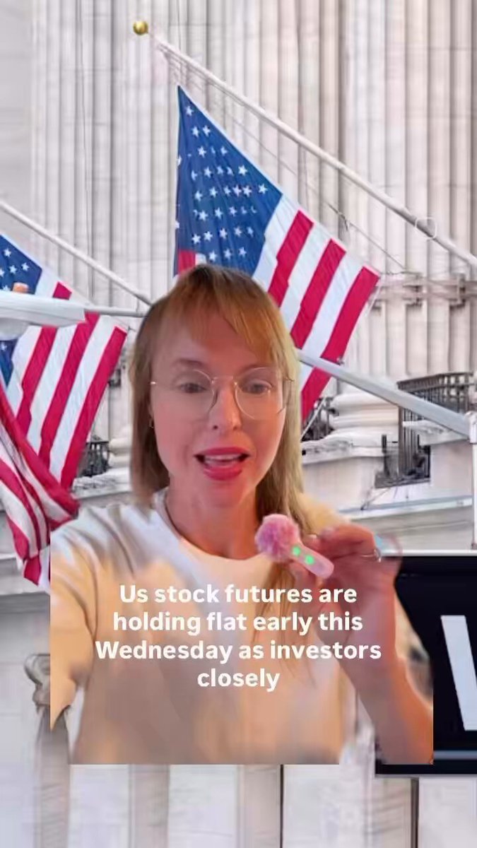 The image features a woman wearing glasses, standing next to two American flags with the text "US Stock Futures are holding flat US-Iran peace talks may take days $LUNC SEI shine In Finance Today". The woman appears to be talking about the stock market and its impact on international relations. She is positioned in front of these flags, which suggests that she might be discussing the financial implications or potential outcomes of the ongoing peace talks between the United States and Iran.

The image also contains a caption that reads "Focus on what is in the image and how it relates to the post". This indicates that the woman's speech may be related to the content of the image, possibly highlighting the connection between stock market fluctuations and international events such as peace talks or conflicts.