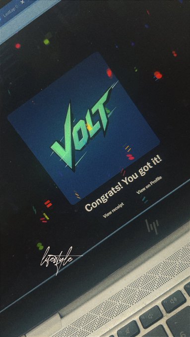 A photograph of an HP laptop screen displaying a digital achievement with the word 'VOLT' in stylized green text and the message 'Congrats! You got it!'