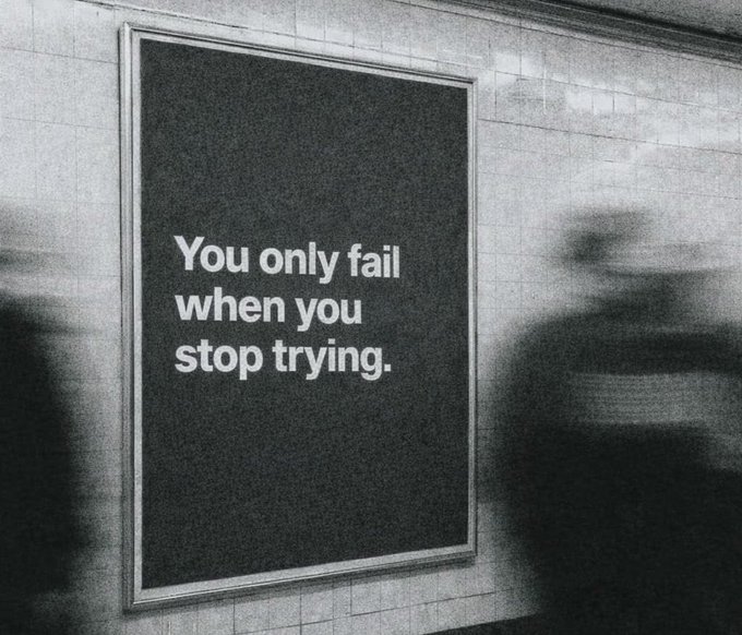 The image features an advertisement for a sleep tracking app, which has been posted to a subway wall. The poster reads "You only fail when you stop trying," with a person's silhouette visible behind the poster. This message encourages users to track their sleep patterns and make positive changes in their habits to improve their overall well-being.

The advertisement is placed on a subway wall, which suggests that it is intended for commuters who spend a significant amount of time traveling during the day. The poster serves as a reminder to prioritize self-care and personal development by focusing on sleep hygiene and making positive changes in daily routines.