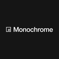 A simple graphic featuring the text 'Monochrome' next to a small icon on a black background.