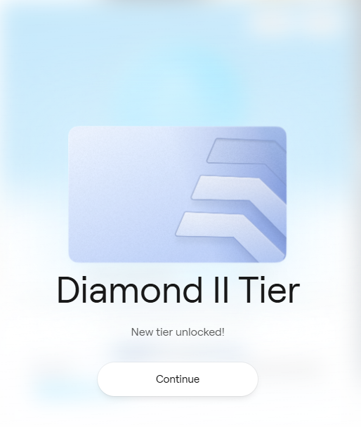 A tier-unlock notification screen displaying a blue tier badge with the text 'Diamond II Tier', 'New tier unlocked!', and a 'Continue' button.