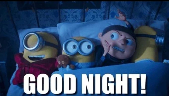 An animated Gru lies in bed between two Minions, looking worried while the Minions appear asleep. Large bold white text across the bottom reads “GOOD NIGHT!”