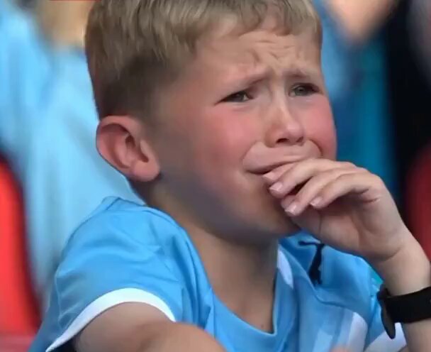 The image shows a young boy wearing a blue shirt, sitting in front of an audience with his hand over his mouth as if he's crying. The background reveals that there are people watching him, indicating that this could be a sports event or some other public gathering. The caption "unemployed crypto guy when his parents tell him to find a job or move out" suggests that the boy might have been upset about not being able to attend an event or participate in something he was looking forward to due to financial constraints.

The image seems to be related to the post, as it features a young boy who is crying and sitting in front of an audience, which could imply that his parents are trying to motivate him by telling him about the importance of finding a job or moving out. The caption might also suggest that the boy's situation is not unique, with others facing similar challenges due to financial circumstances.