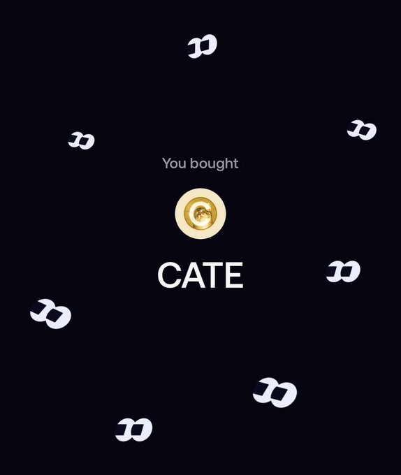 The image shows a confirmation screen displaying "You bought CATE" with a gold coin icon in the center, surrounded by animated letter "D" logos against a black background. The graphic visually celebrates the user's recent purchase of CATE tokens, aligning with the post announcing their continued accumulation of the coin in anticipation of an airdrop.