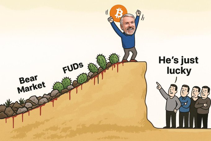 The cartoon depicts Michael Saylor triumphantly holding a Bitcoin logo while climbing a cliff of obstacles labeled "Bear Market" and "FUDs" (with blood dripping from the hazards), as onlookers below dismissively remark "He's just lucky."

This imagery illustrates how critics once dismissed Saylor's massive Bitcoin bet as reckless or fortunate, yet he has now accumulated nearly $7.9B in unrealized profits—vindicating his strategy against both market downturns and doubters.
