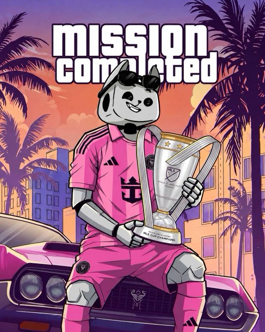 A robot character in a pink soccer kit holds a trophy labeled "MLS Cup Champions" with the text "MISSION COMPLETED" above, blending GTA VI aesthetics with soccer victory imagery against a sunset cityscape. The artwork ties into the post's theme by merging football culture with PrismaX branding.