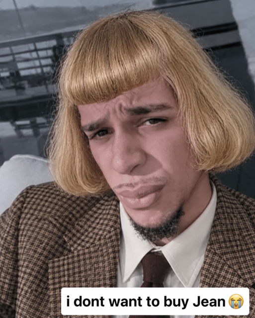A meme featuring a person wearing a blonde bob wig and plaid blazer with a sad expression, captioned 'i dont want to buy Jean 😭'.