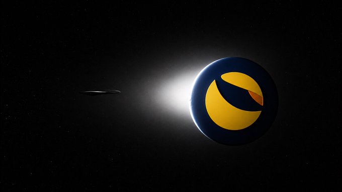 An abstract digital artwork showing a glowing dark sphere with a yellow crescent and orange shape, accompanied by a dark ringed planet, set against a starry black background.