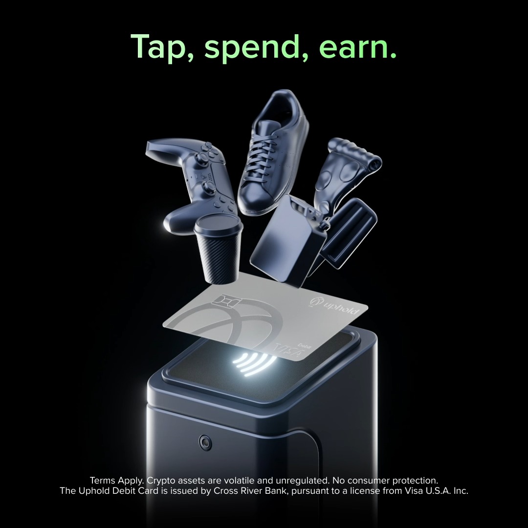 A promotional ad for the Uphold Debit Card featuring the tagline "Tap, spend, earn." in green text, showing a metallic Uphold card hovering above a contactless payment terminal with various items (a sneaker, game controller, coffee cup, travel mug, and lighter) emerging from it. The image aligns with the post by illustrating everyday purchases that earn up to 4% back in XRP, with a disclaimer noting the card is issued by Cross River Bank pursuant to a Visa U.S.A. Inc. license.