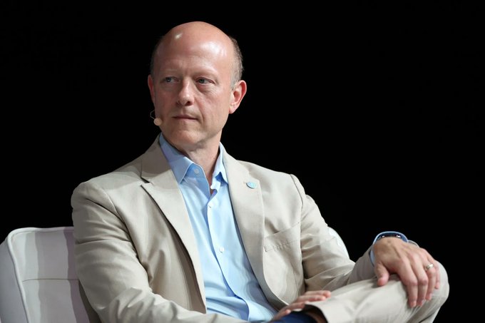 Circle CEO Jeremy Allaire sits on stage, appearing at a conference or interview setting, as the post discusses his remarks about the GENIUS Act and the future of institutional financial infrastructure.