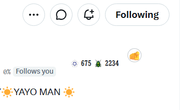 The image shows a screenshot of a social media post from a person named "Yaro Man". The post contains information about the person's phone number, which is 675-2394. There are also some emojis in the post, including suns and a bug. A chatbot logo is displayed at the top, indicating that this message might be related to a chatbot or automated messaging service on social media platforms such as Facebook Messenger, WhatsApp, or Instagram.