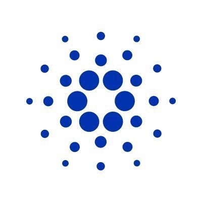 The Cardano (ADA) cryptocurrency logo, consisting of a hexagonal pattern of blue dots arranged in a flower-like or geometric cluster design on a white background.