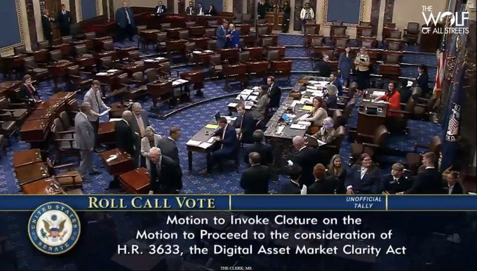A screenshot from "The Wolf of All Streets" showing the U.S. Senate chamber during a roll call vote, with on-screen text reading "Motion to Invoke Cloture on the Motion to Proceed to the consideration of H.R. 3633, the Digital Asset Market Clarity Act."