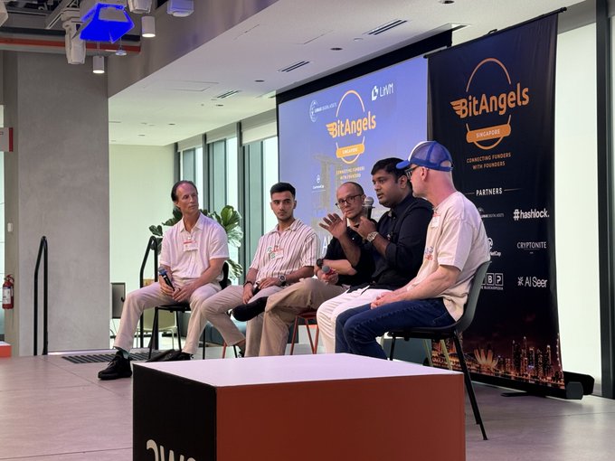 A panel discussion at the BitAngels Singapore event with five seated speakers on stage, featuring partners like Hashlock, Cryptonite, and AStar.