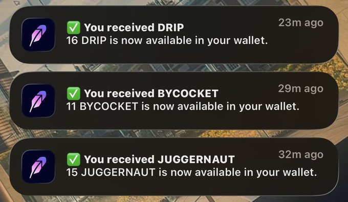 Mobile notification screen showing three token reward alerts: 'You received DRIP' (16), 'You received BYCOCKET' (11), and 'You received JUGGERNAUT' (15) all marked with green checkmarks.