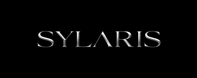 The image shows a logo for a company named " Sylaris" that promotes itself as a cryptocurrency. The word "Sylarris" appears prominently in the center of the image, drawing attention from viewers who may be interested in learning more about this digital currency. The text also mentions the "most meme coins were created to be forgotten," implying that the company's goal is to create an innovative and forgettable product or project. Additionally, it highlights the importance of starting with nothing and aiming for success. The logo is accompanied by a hashtag (#Sylarris) in the image description, indicating that users may share this post on social media platforms to spread awareness about the brand or cryptocurrency.