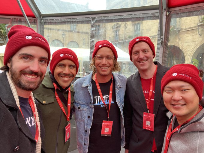 Five smiling people wearing matching red "POKT" beanies and lanyards pose for a group photo, likely at a Pocket Network event. The caption highlights a meetup with Adam Liposky, co-founder and CEO of Canopy Network ($Canopy), celebrating his work in making sovereign L1s accessible.