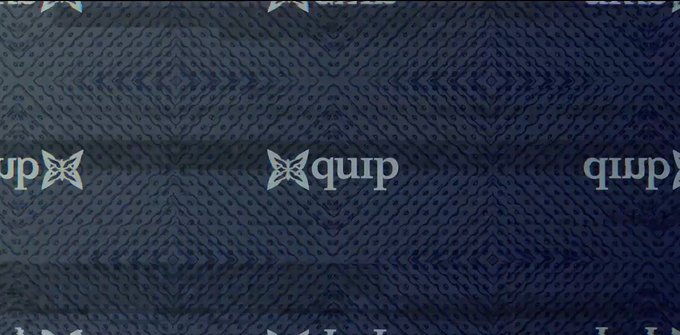 The image features a patterned blue fabric with white text, including the words "quip" and "@quipnetwork", which appears to be related to an AI or machine learning company. The text is positioned at the bottom of the image, drawing attention to its importance in the context of the post.