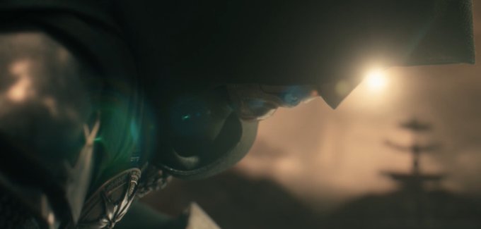 A close-up shot shows a character in a futuristic helmet, with their glowing blue eyes piercing through the darkness. The character's determined and intense gaze suggests a powerful, unstoppable force, hinting at the idea that nothing can stop them in their mission.