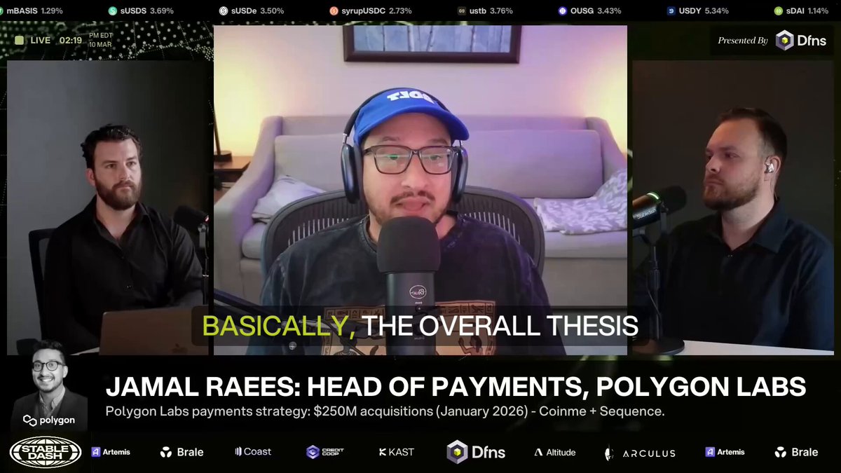 The image shows a group of three men sitting behind microphones, appearing to be participating in an online podcast or radio show. The hosts are wearing headphones, suggesting that they might be discussing a topic related to payments or sharing their thoughts about the Open Money Stack project. The background features a couch and a chair, indicating that this could be taking place at someone's home or a studio setting.