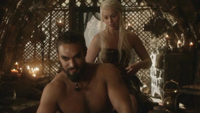 A shirtless, muscular bearded man sits in a dimly lit tent with candles, while a blonde woman in a dark dress stands behind him, touching his shoulder. The scene evokes a "bargain" or hidden value—the woman appears to have "picked" the man at a low point, much like an investor recognizing a discounted asset, mirroring the post's thesis that $TRUMP is undervalued at a $6B market cap despite massive brand recognition, ready for a major rebound.