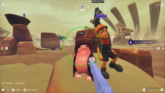 A screenshot from a 3D video game showing a character with orange hair and goggles standing next to a small mole-like creature labeled 'J Mo' that is circled in green.