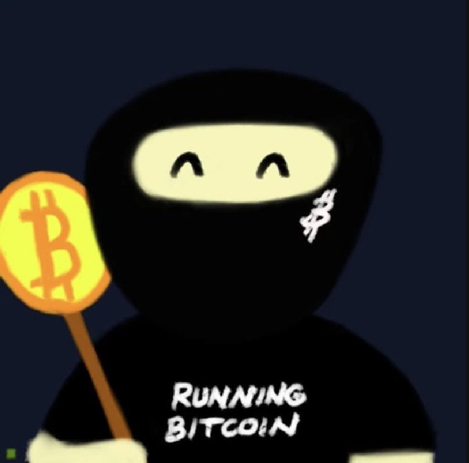An animated ninja character wearing a black mask with a Bitcoin symbol on it, smiling and holding a sign with the Bitcoin logo, with the text 'Running Bitcoin' on its shirt.