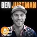 The cover art for 'The Ben & Jortman Podcast' featuring a black and white portrait of a smiling man wearing a white baseball cap and patterned shirt against a black background.
