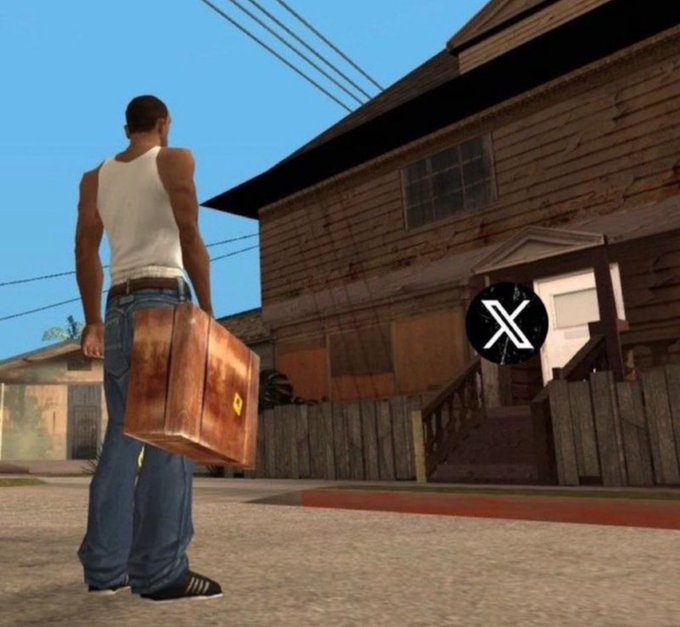 A character from the video game Grand Theft Auto: San Andreas stands holding a brown suitcase in front of a wooden house, with an X logo (Twitter/X) overlaid on the image.