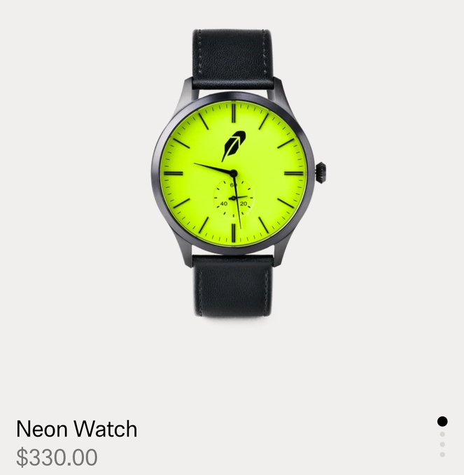 A neon yellow-faced watch with a small sub-dial, black leather strap, and black case displays the "Neon Watch" priced at $330.00. The watch features a distinctive black feather/leaf logo that matches the $WALLET token's branding, suggesting the timepiece is an official merchandise collaboration tied to the cryptocurrency project.