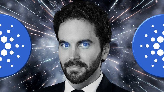 A black and white portrait of a bearded man with bright blue eyes, flanked by two blue circular Cardano (ADA) cryptocurrency logos against a cosmic/starburst background.