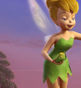 Tinker Bell, the iconic fairy from Disney's Peter Pan, appears in her classic green leaf dress with translucent wings, holding what appears to be a small pouch against a pink and purple sunset sky.