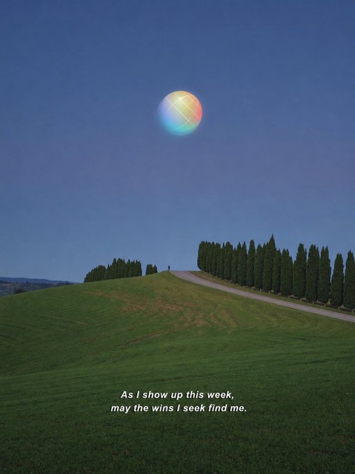 A scenic view of a green hill with cypress trees under a blue sky, featuring a large multicolored balloon-like object in the air and the caption 'As I show up this week, may the wins I seek find me.'