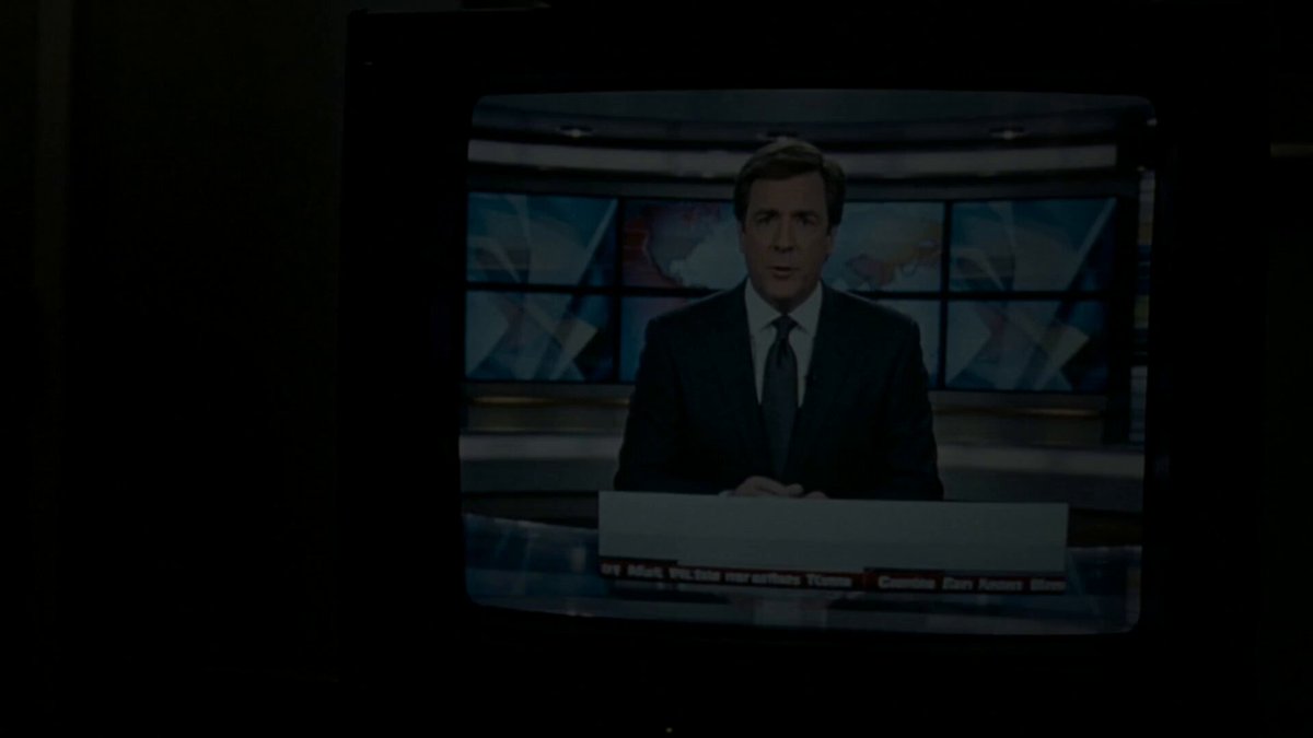 The image shows a television screen displaying a news reporter wearing a suit, sitting at a desk with a microphone. The TV is turned off, but the reporter's presence can be seen through the screen. The background of the image features a black wall with multiple screens mounted on it, suggesting that this might be an office or newsroom setting where various news programs are being broadcasted simultaneously.

The post includes text about AI and blockchain technology, which could potentially be related to the content displayed on the television screen. It seems like there is some connection between the reporter's role in delivering news and the advancements in artificial intelligence and blockchain technology that might be influencing the media landscape.