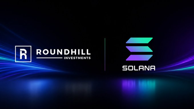 A dark promotional graphic features the white "Roundhill Investments" logo on the left and the purple-gradient Solana logo on the right, visually representing the partnership highlighted in the announcement that Roundhill's $DRAM token has launched on the Solana blockchain.