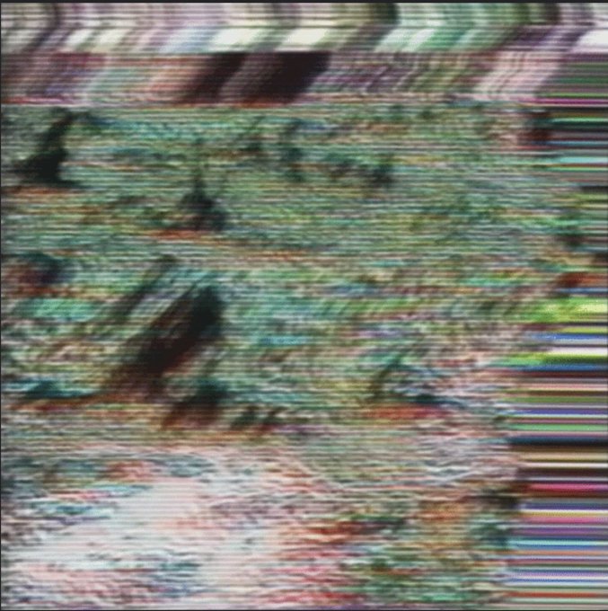 A heavily distorted image is covered in colorful static, horizontal glitch lines, and digital artifacts, obscuring any recognizable subject.