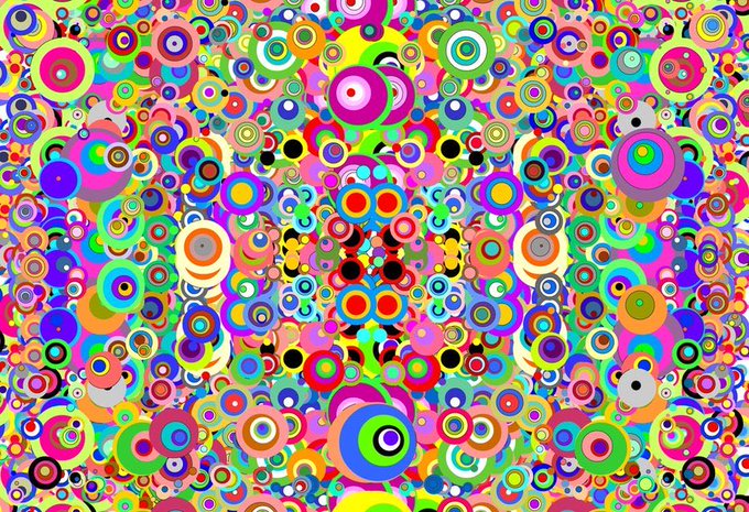 A densely packed, kaleidoscopic pattern of multicolored concentric circles in vivid hues, creating a psychedelic, symmetrical visual effect.