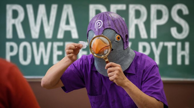 A person dressed in a purple shirt and a purple penguin mask holds a magnifying glass and a small white object, standing in front of a chalkboard reading 'RWA DERPS POWER PURPLE'.