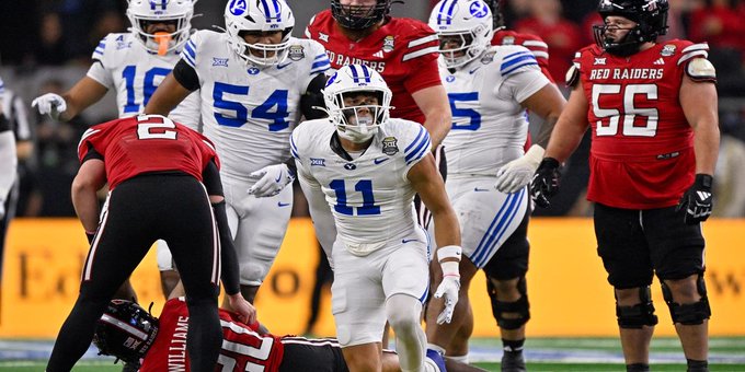 BYU linebacker #11 celebrates on the field alongside Texas Tech players (#54, #56) after a big defensive stop, with teammate #21 standing over a downed Red Raiders player named Williams. The image of a fired-up BYU defender in white and blue gear visually underscores the post's bold claim that he will climb significantly above his current 7th ranking by season's end.