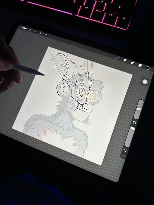 A hand using a stylus on a tablet, digitally sketching a furry character with antlers on a grid background.