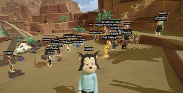 The image shows a group of avatars gathered in a desert-like virtual world, with usernames like "Chief Indian Viking" and "Smudgybox" visible above their heads, tied to the post's shoutout to @Smudgybox as a host of the @FelineFiendz event.