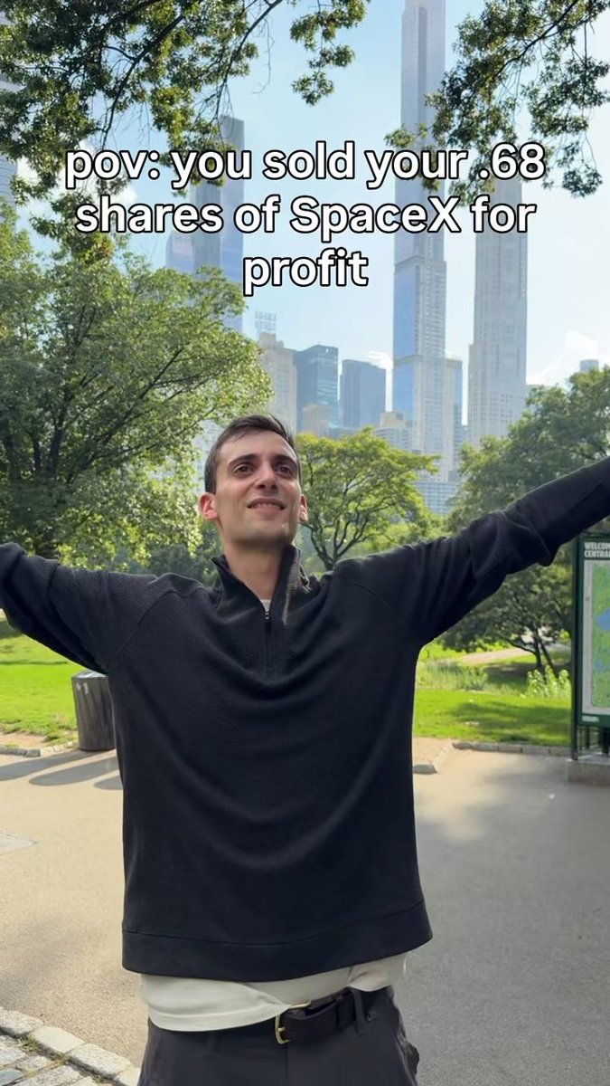 A man stands triumphantly in Central Park with his arms outstretched in celebration, with text overlay reading "pov: you sold your .68 shares of SpaceX for profit," capturing the joy of cashing out a small SpaceX ($SPCX) investment.