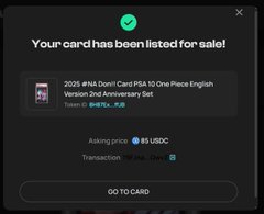 A mobile app notification screen showing a digital card listing for a '2025 #NA [Don] Card PISA 10 One Piece English Version 2nd Anniversary Set' priced at 85 USDC.