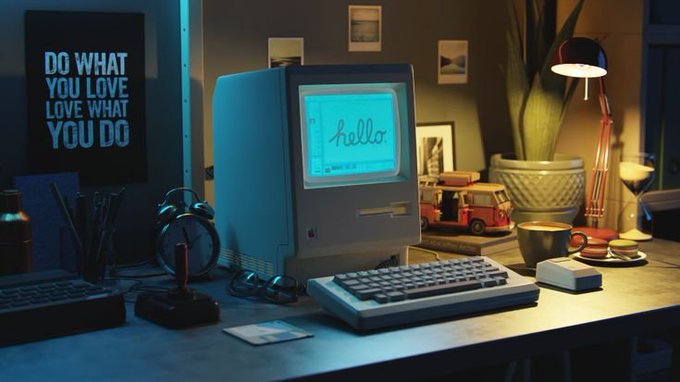 A retro computer monitor displaying the word "hello" sits on a desk beside a poster reading "DO WHAT YOU LOVE LOVE WHAT YOU DO," symbolizing the warm, personal beginning of a new technology—mirroring the post's announcement of the Court of Internet's launch as a live dispute protocol for AI agents, with GenLayer as a founding member.