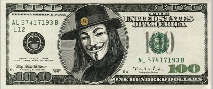 A modified $100 bill featuring a Guy Fawkes mask (Anonymous) instead of Benjamin Franklin, with a Bitcoin logo on the hat.