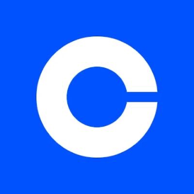 The Coinbase logo is displayed on a blue background, representing the major cryptocurrency exchange platform. The image ties to the post's theme of bridging traditional finance and crypto, illustrating Coinbase's role as a hybrid gateway that allows users to engage with digital assets while remaining connected to the legacy financial system.